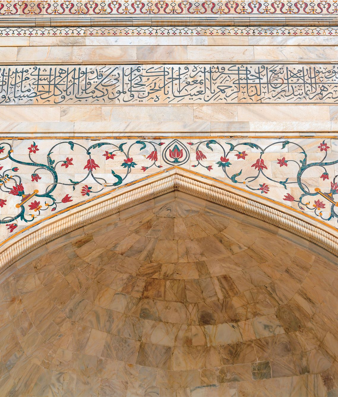 On the façade of the Taj Mahal, a majestic calligraphic inscription adorns the walls in the distinguished thuluth style.